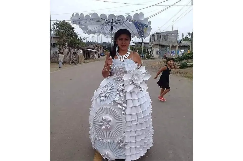 Gown made from recycled plastic plates, spoons and forks with matching parasol—DIY costume